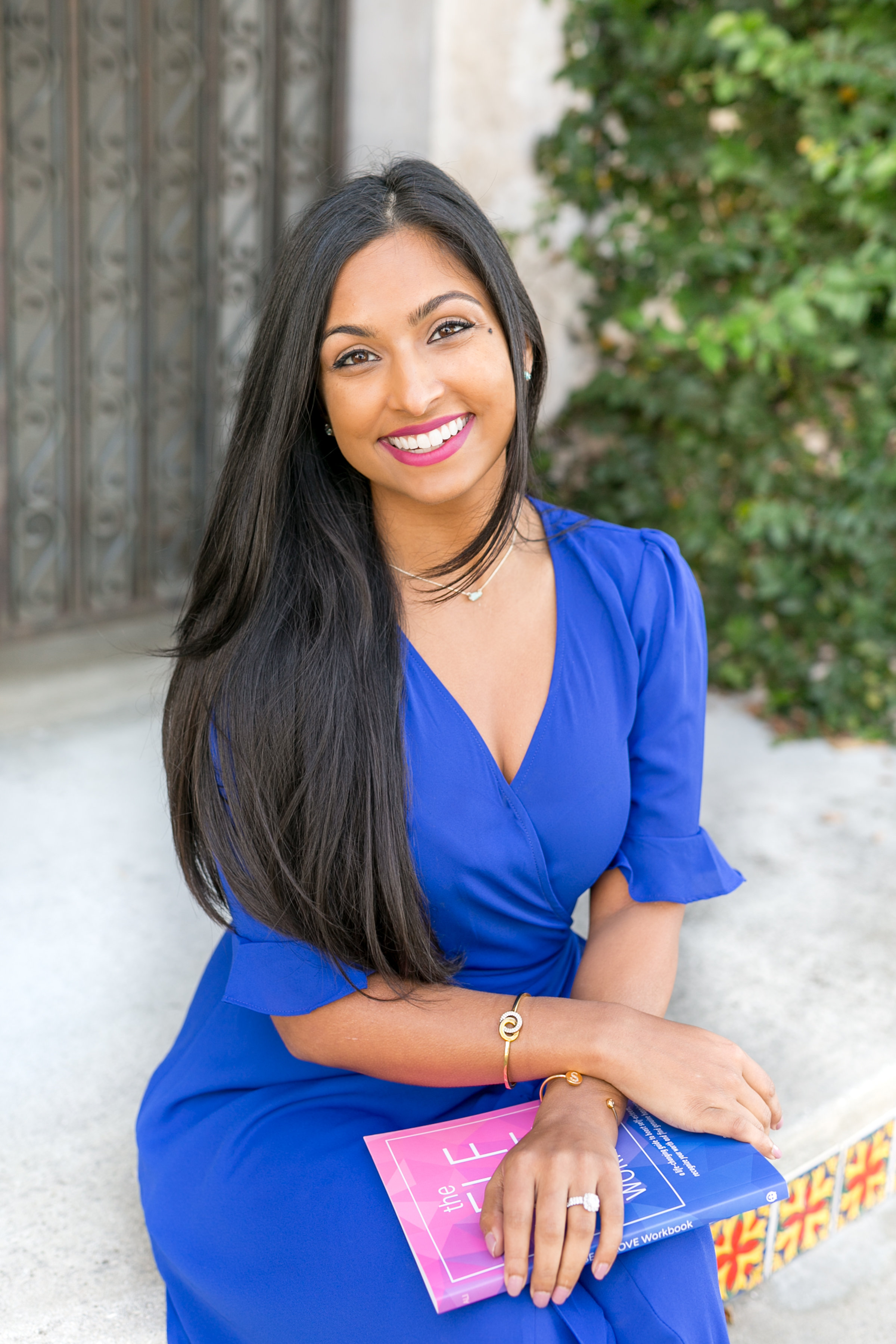 Dr. Shainna with workbook by ivy wall